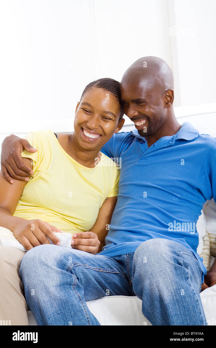 young happy african american couple relaxing at home on sofa Stock ...