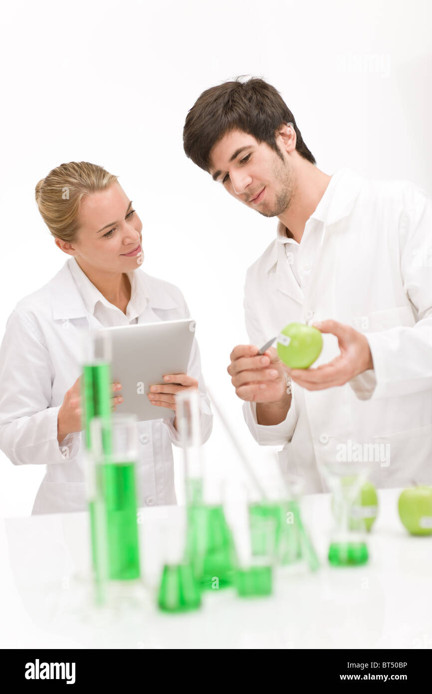 Genetic engineering - scientists in laboratory, GMO testing experiment Stock Photo
