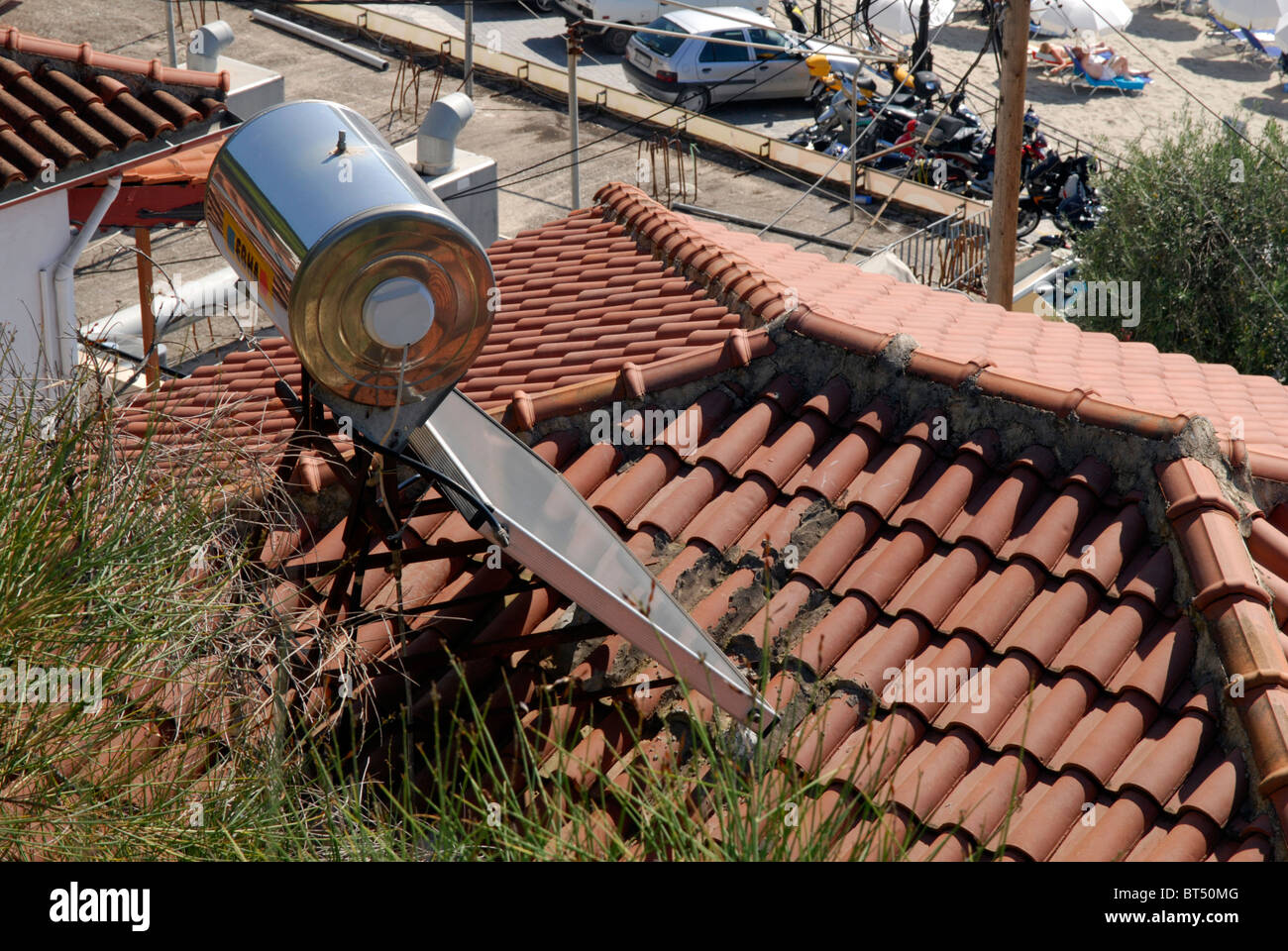 Solar water heating panel and tank on roof in Parga, Epirus, Greece Stock Photo