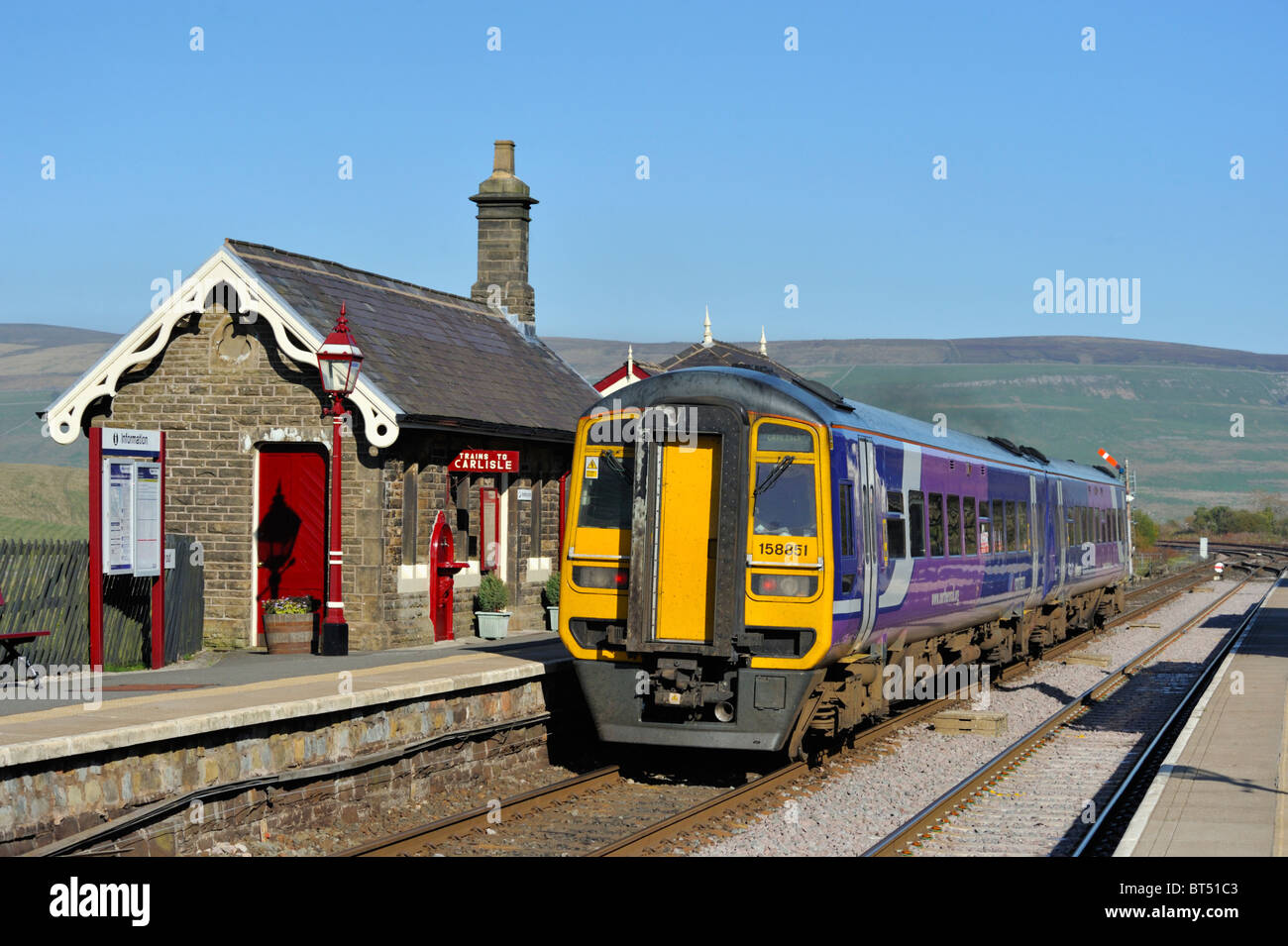 Northbound Class 158 Northern Rail passenger train at Garsdale Station. Settle-Carlisle Railway, Cumbria, England, U.K., Europe. Stock Photo