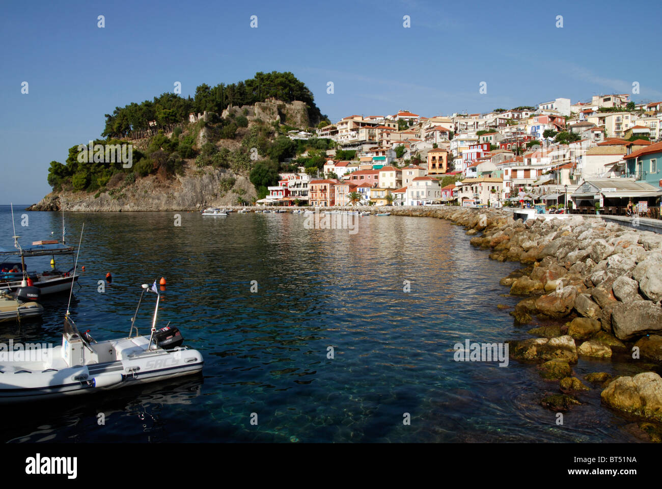 The Harbour at Parga showing the Old Town and Venetian Castle. Stock Photo