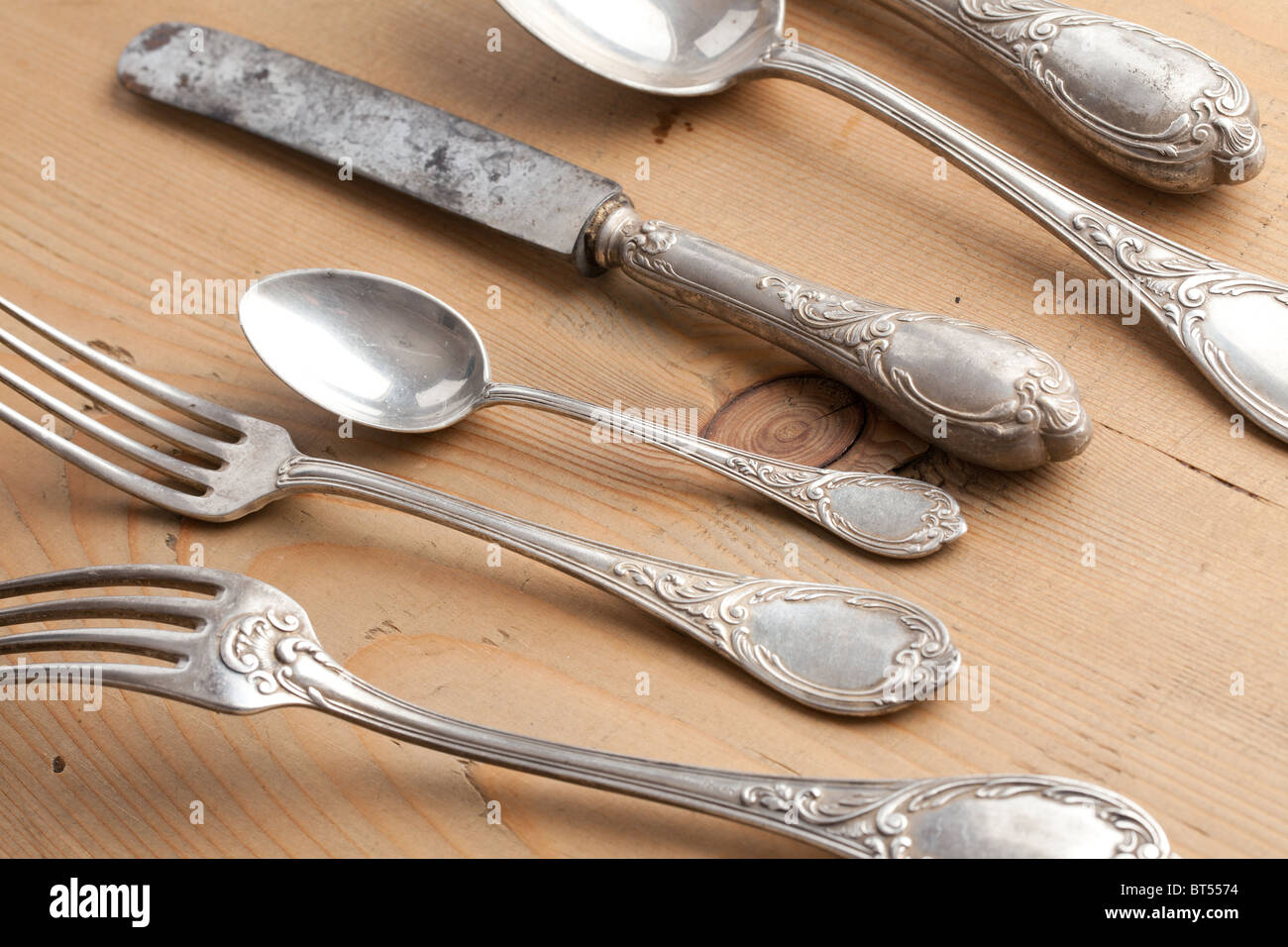 the old cutlery on wooden table Stock Photo - Alamy