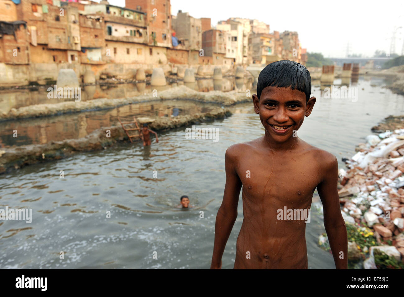 Children swimming in dirty water in India's capital New Delhi Stock