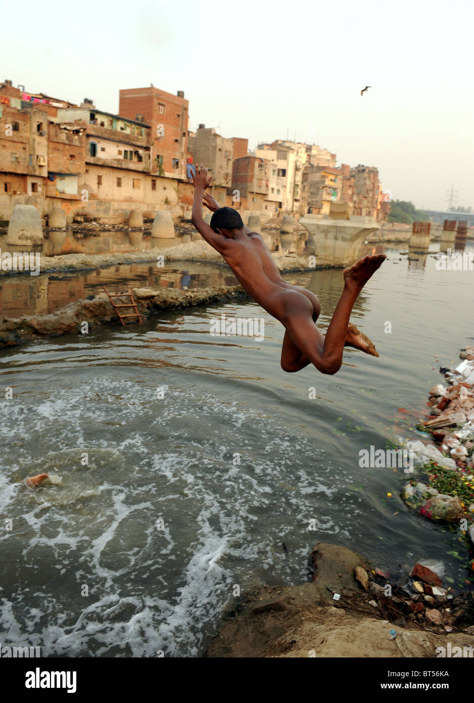 Children swimming in dirty water in India's capital New Delhi Stock