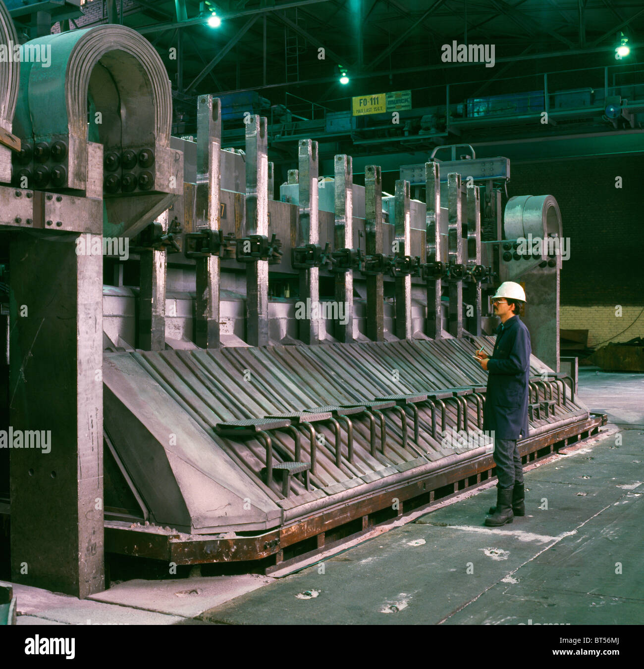 Aluminum production at Hydro Aluminum plant in Norway. The aluminum pot  line with the open door show the rebaked anode and the bauxite Stock Photo  - Alamy
