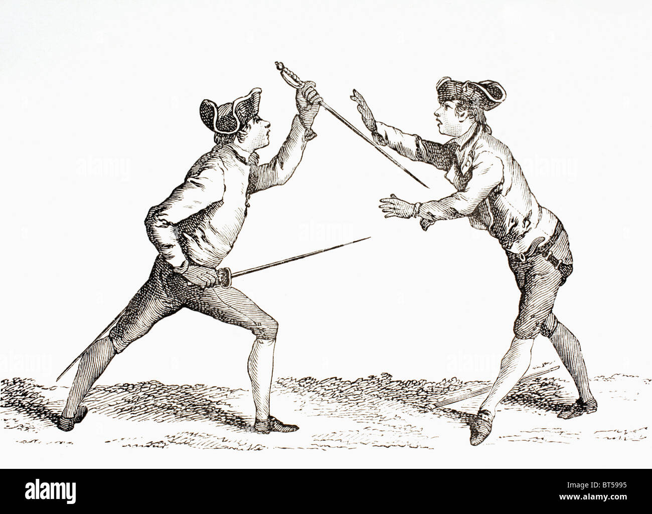 A swordsman disarms his opponent and is in a position to thrust. Stock Photo