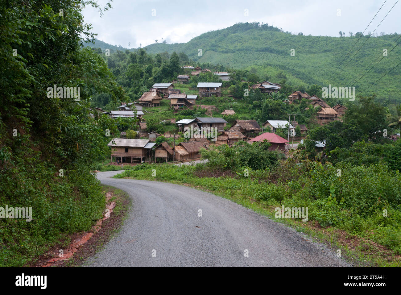 road and village on the Nam Tha river near Na Lae. Northern laos Stock Photo