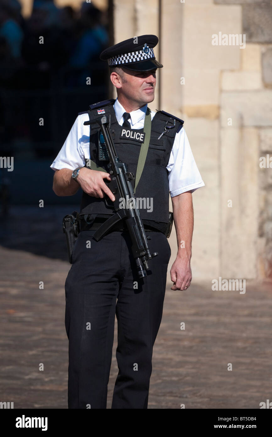 Police Firearms Officer on guard outside Windsor Castle, England, UK