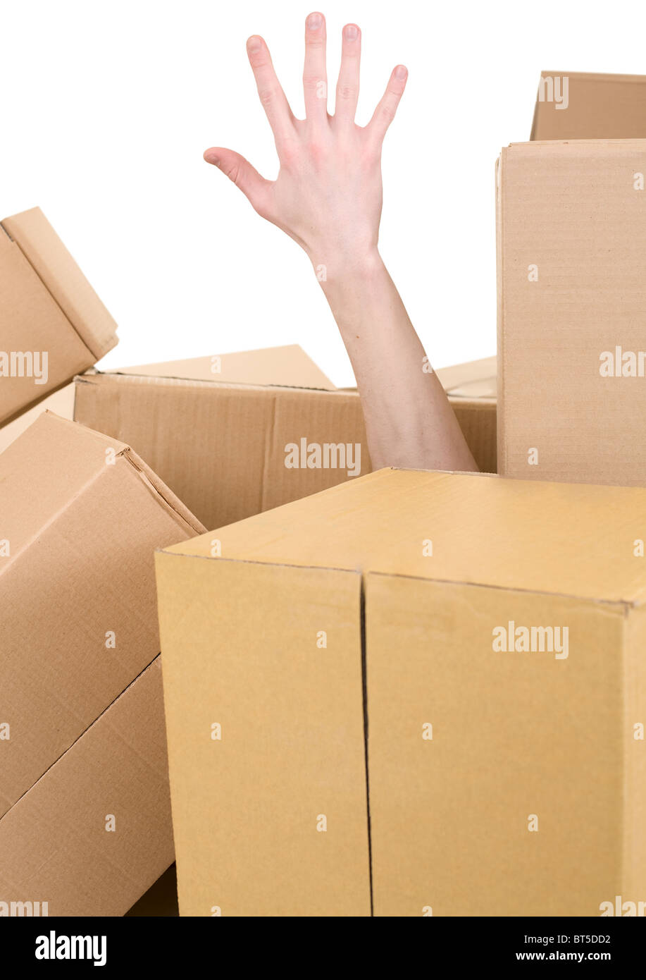 Male hand protruding from pile carton box Stock Photo