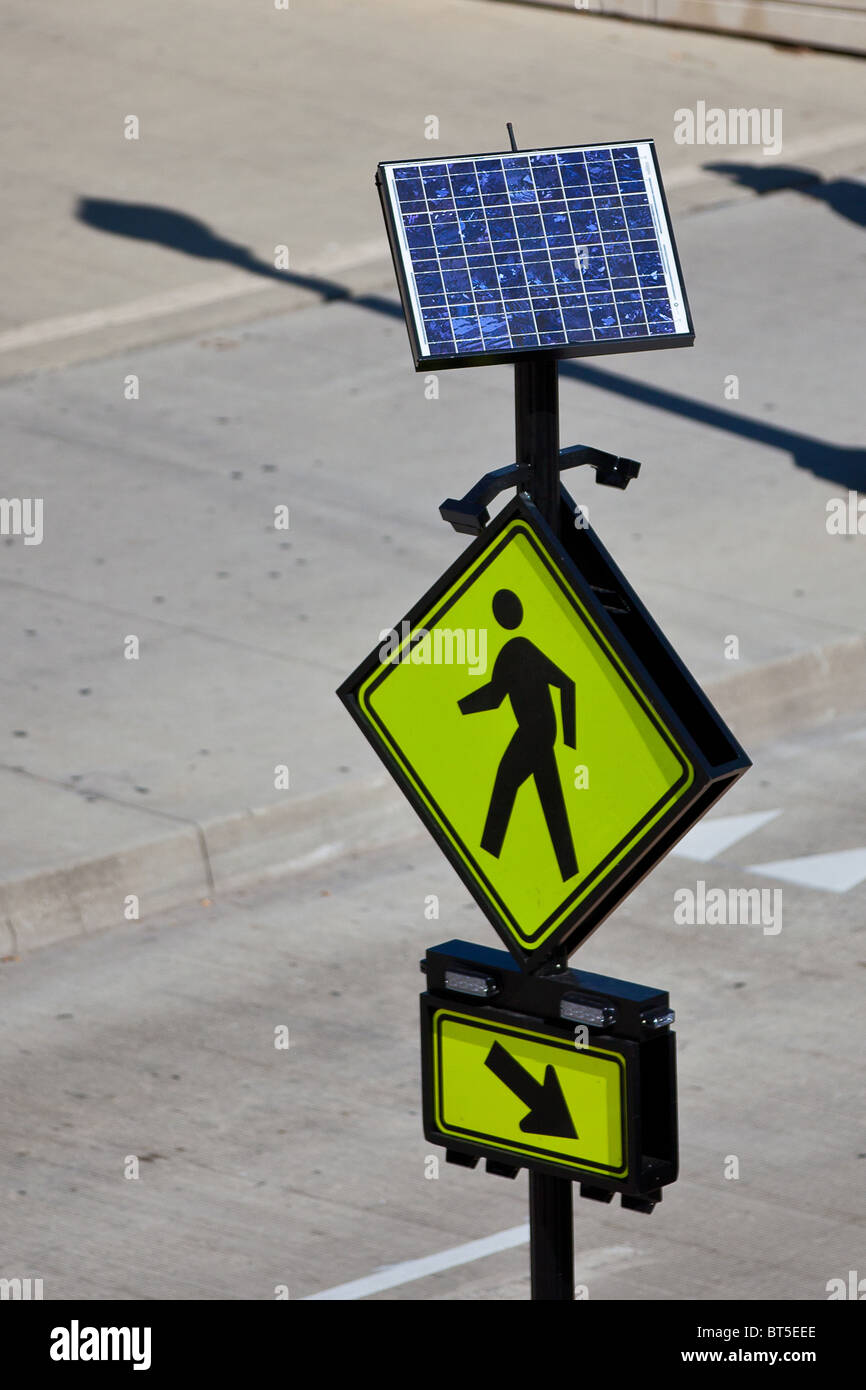 Solar powered pedestrian walk sign on Monroe Street in Chicago, IL, USA. Stock Photo
