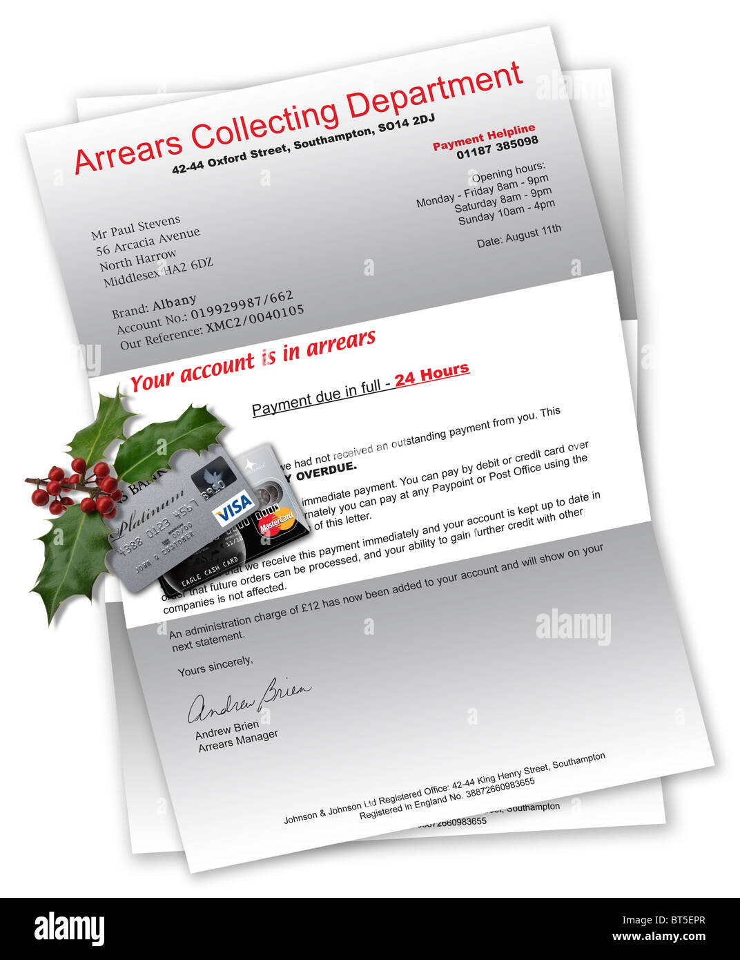 Collection agency letter with credit cards and Christmas holly on top Stock Photo