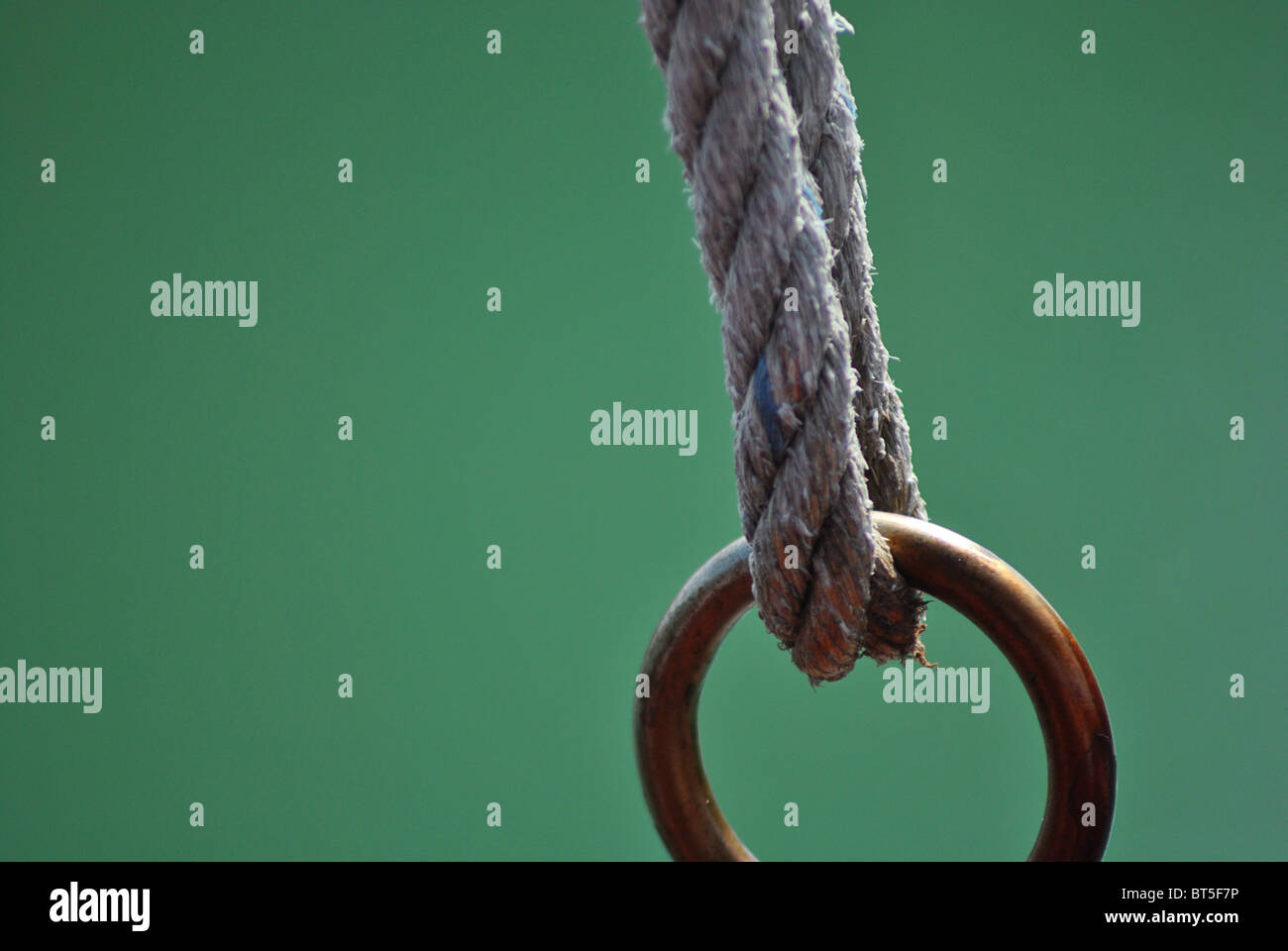 Brass ring and rope Stock Photo