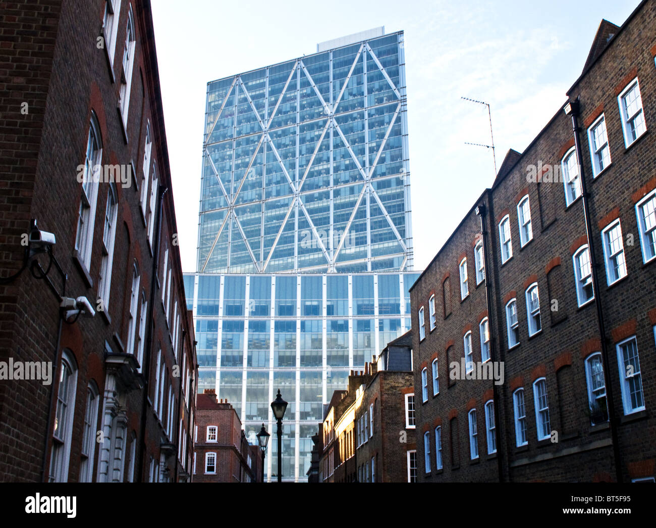 A modern office block at the end of a street in London. Stock Photo