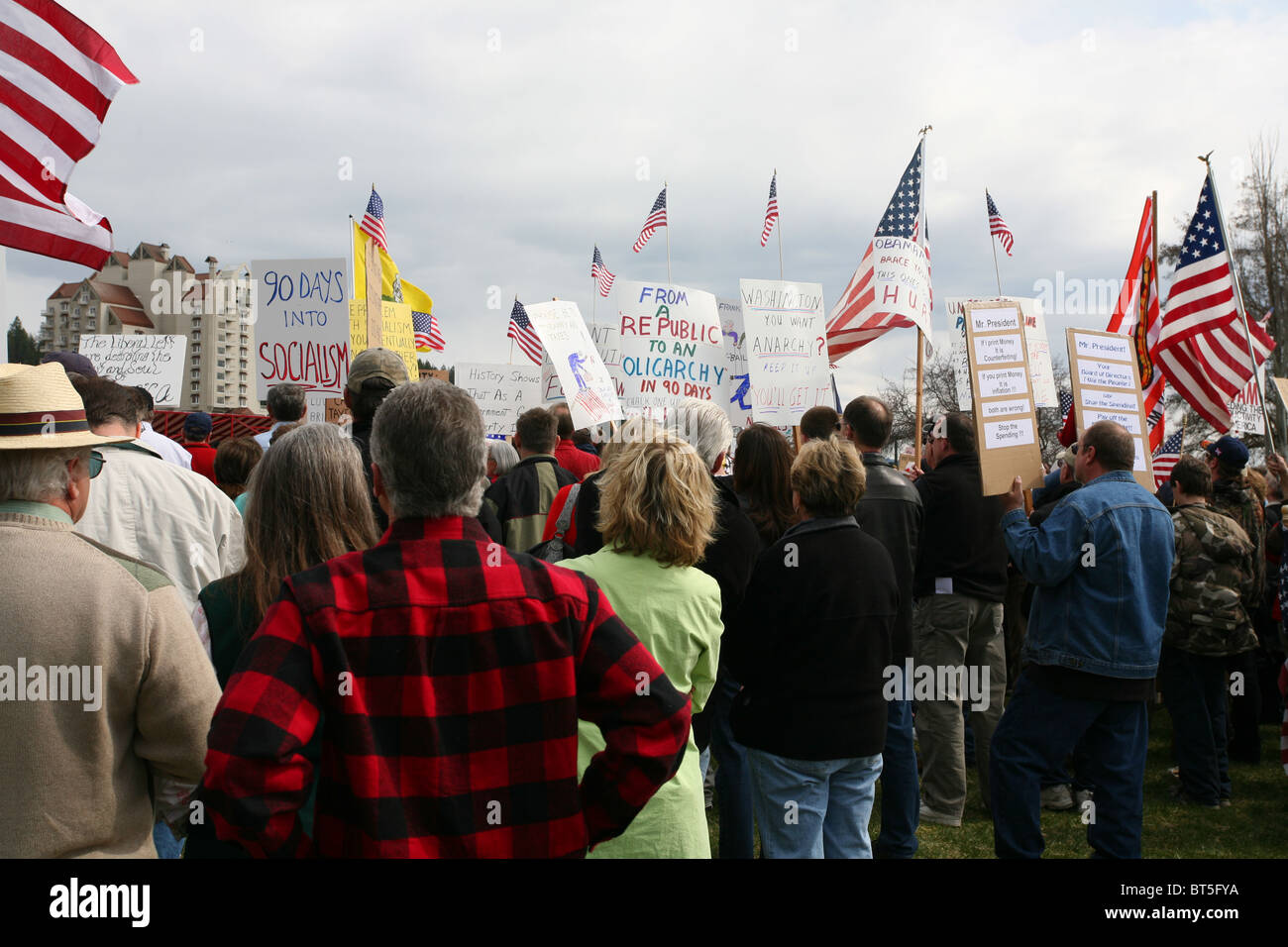 People holding signs and flags, TEA Party rally at Coeur D Alene, Idaho ...