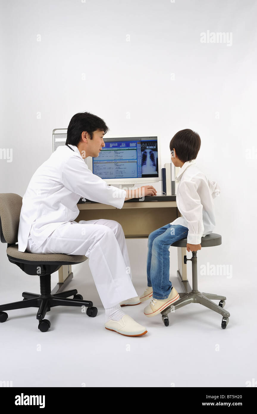 Male doctor talking to patient Stock Photo