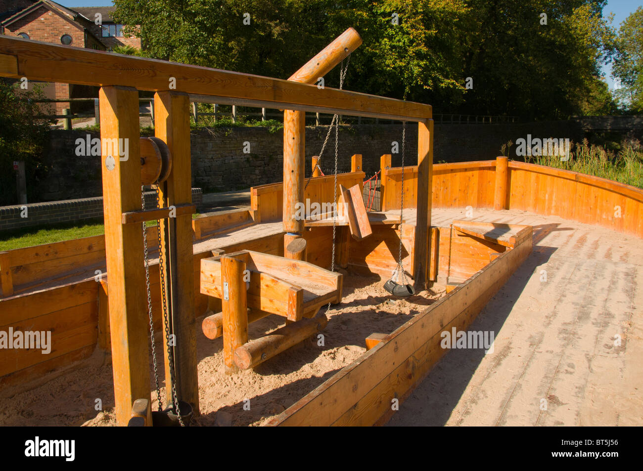 Childrens' sand play area in the shape of a canal narrowboat at Daisy Nook Country Park, Failsworth, Manchester, UK Stock Photo