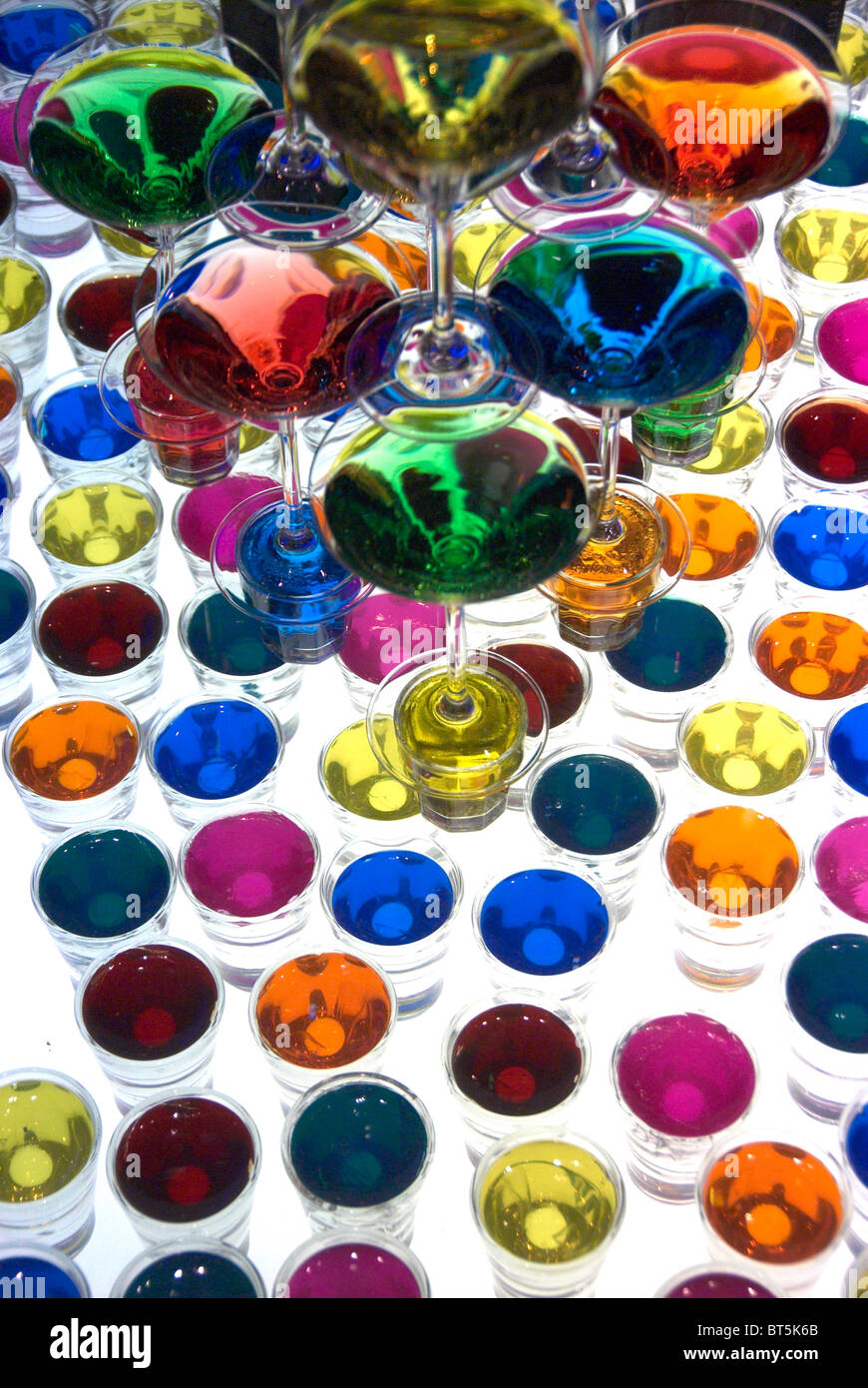 Coloured cocktail glasses on table Stock Photo Alamy