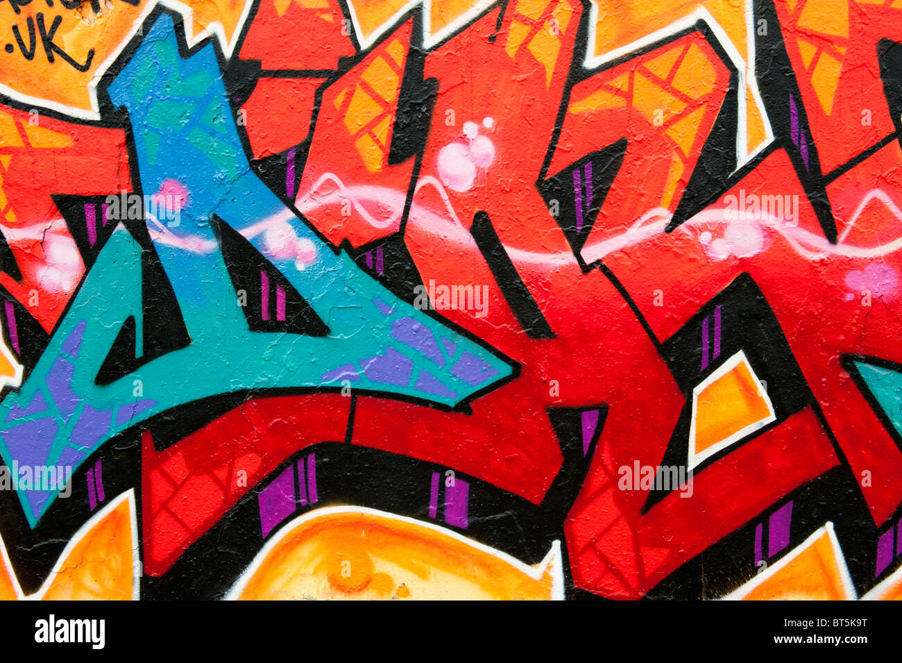 wall graffiti orange and blue Stock Photo - Alamy