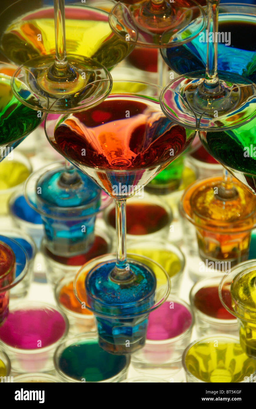 Coloured cocktail glasses on table Stock Photo Alamy