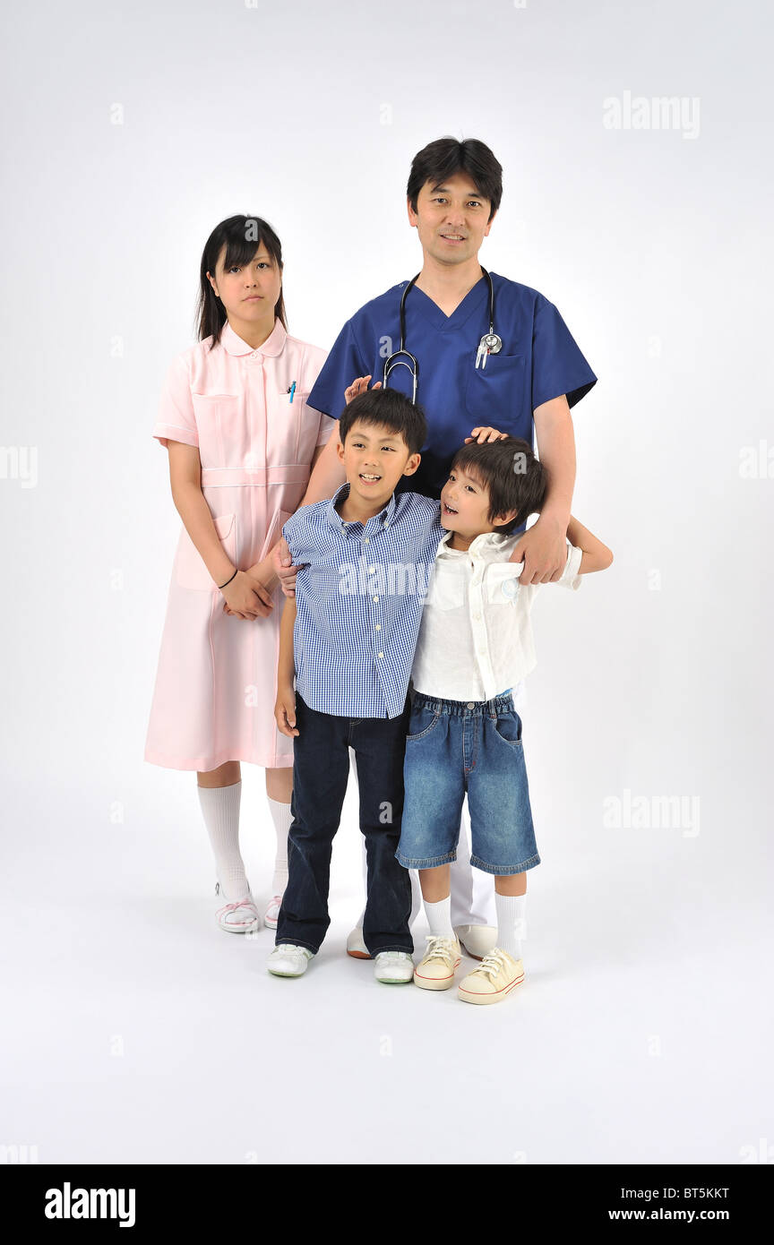 Male doctor, female nurse and children Stock Photo