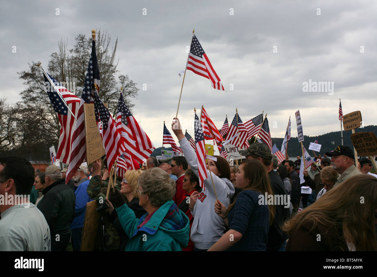 People holding signs and flags, TEA Party rally at Coeur D Alene, Idaho ...