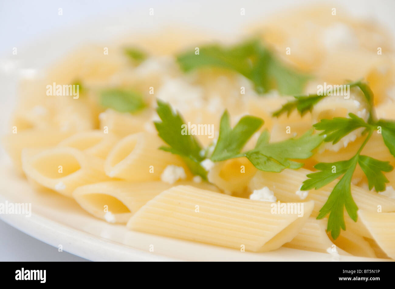 Pasta with cheese and parsley Stock Photo