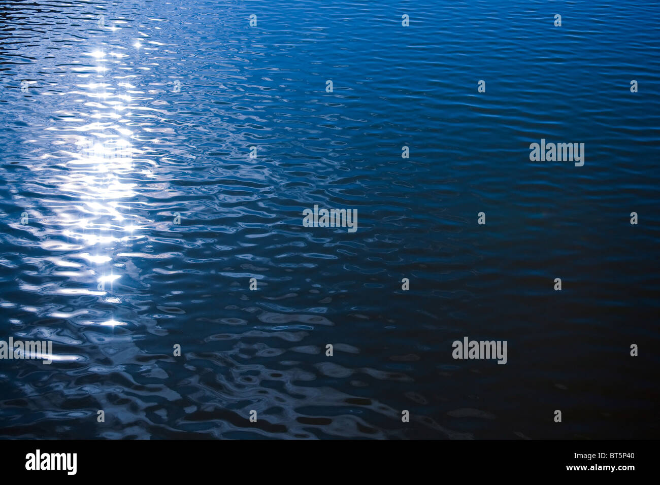 Sunlight reflection in rippled water surface . natural image Stock Photo