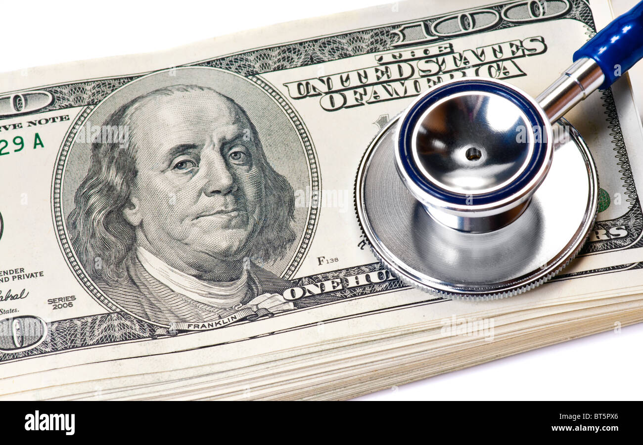 Stethoscope and dollars over white Stock Photo