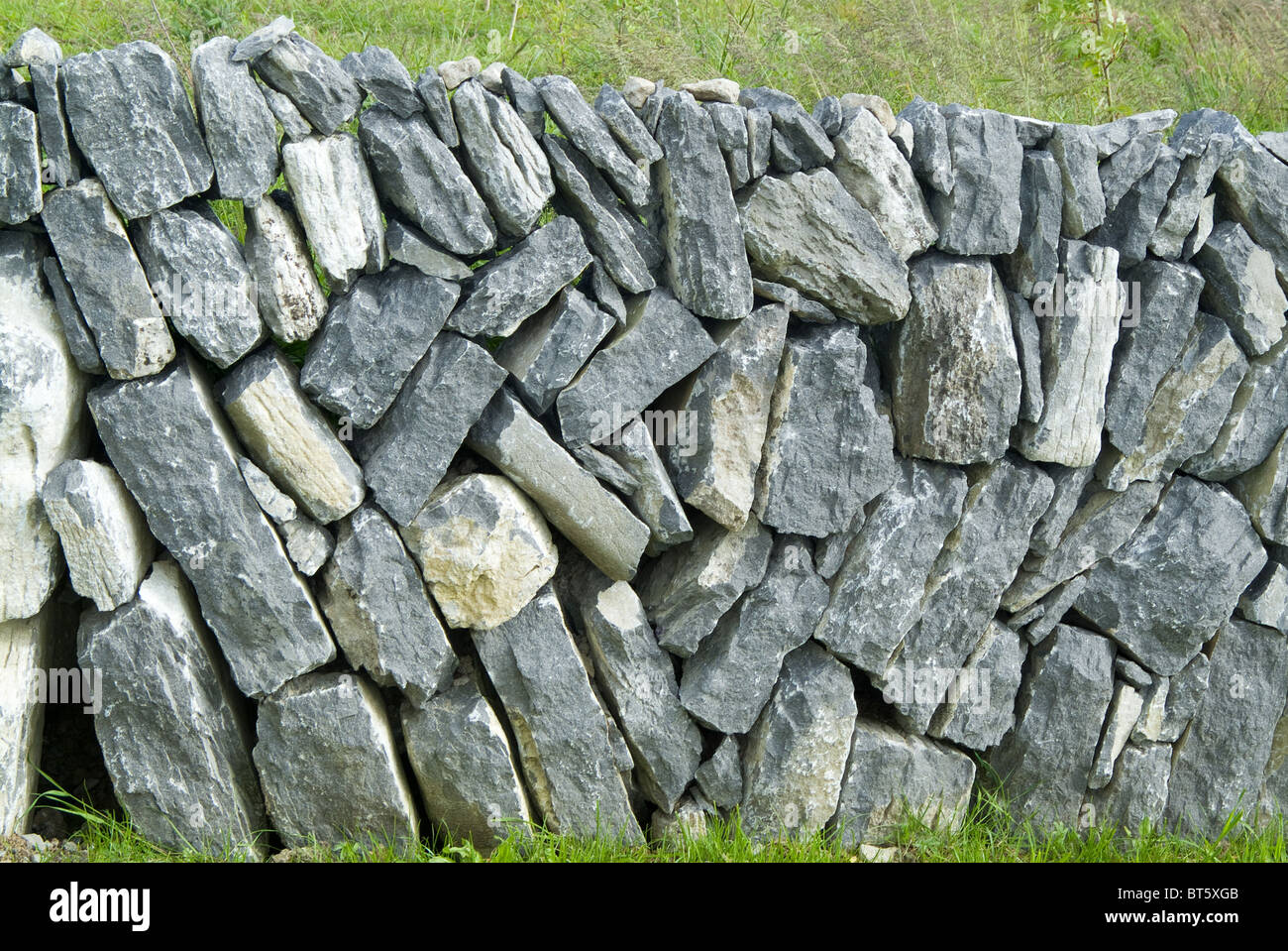 Dry stone wall southern Ireland republic Irish Eire Atlantic coast west boundary barrier pattern abstract, agriculture, ancient, Stock Photo