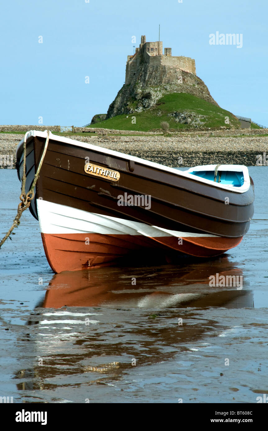 open rowing boat Lindisfarne Northumberland tidal island north east ...