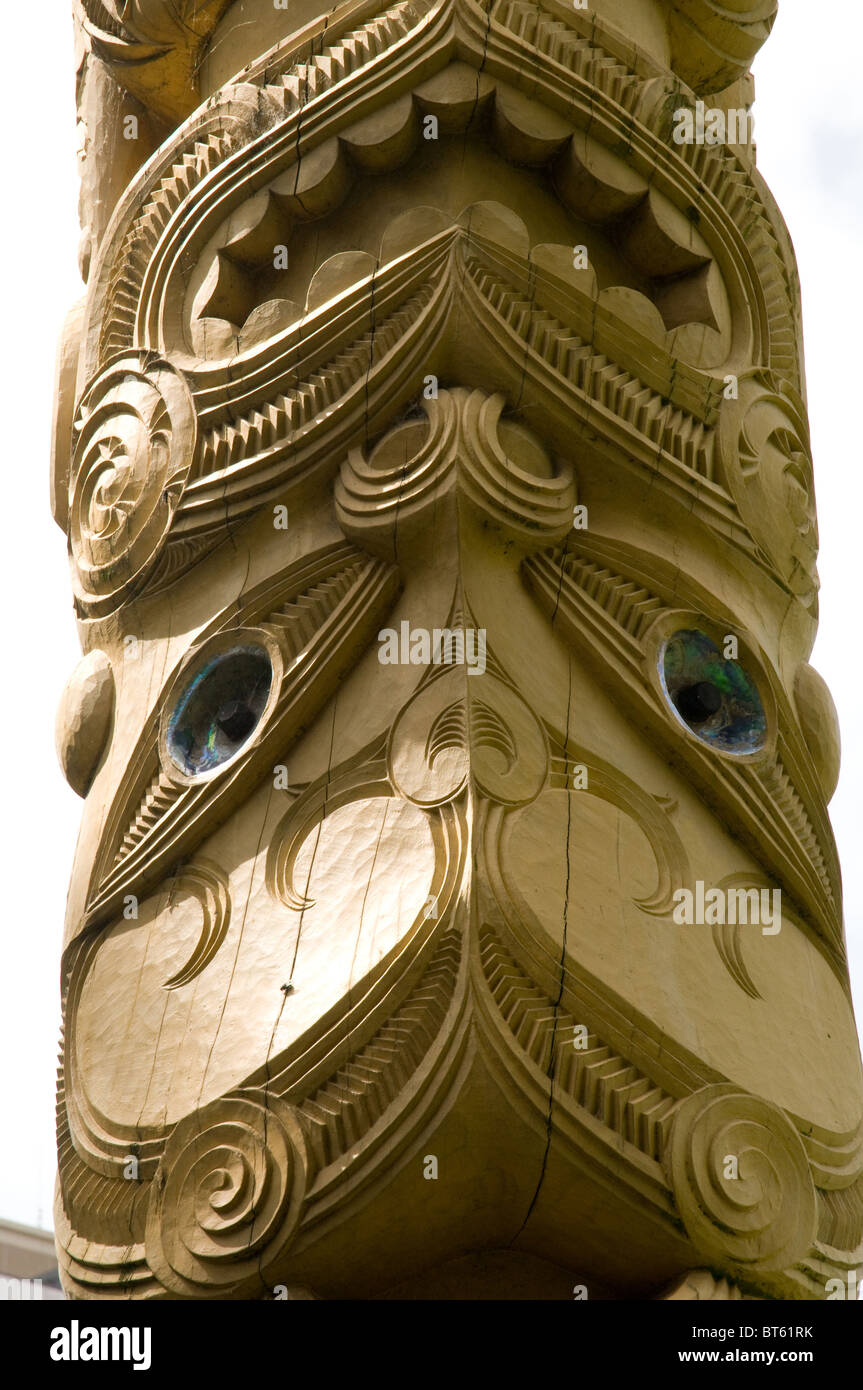 maori totem pole carving wood timber Poupou carved wooden post Victoria Square, Christchurch, New Zealand carved wooden post Stock Photo