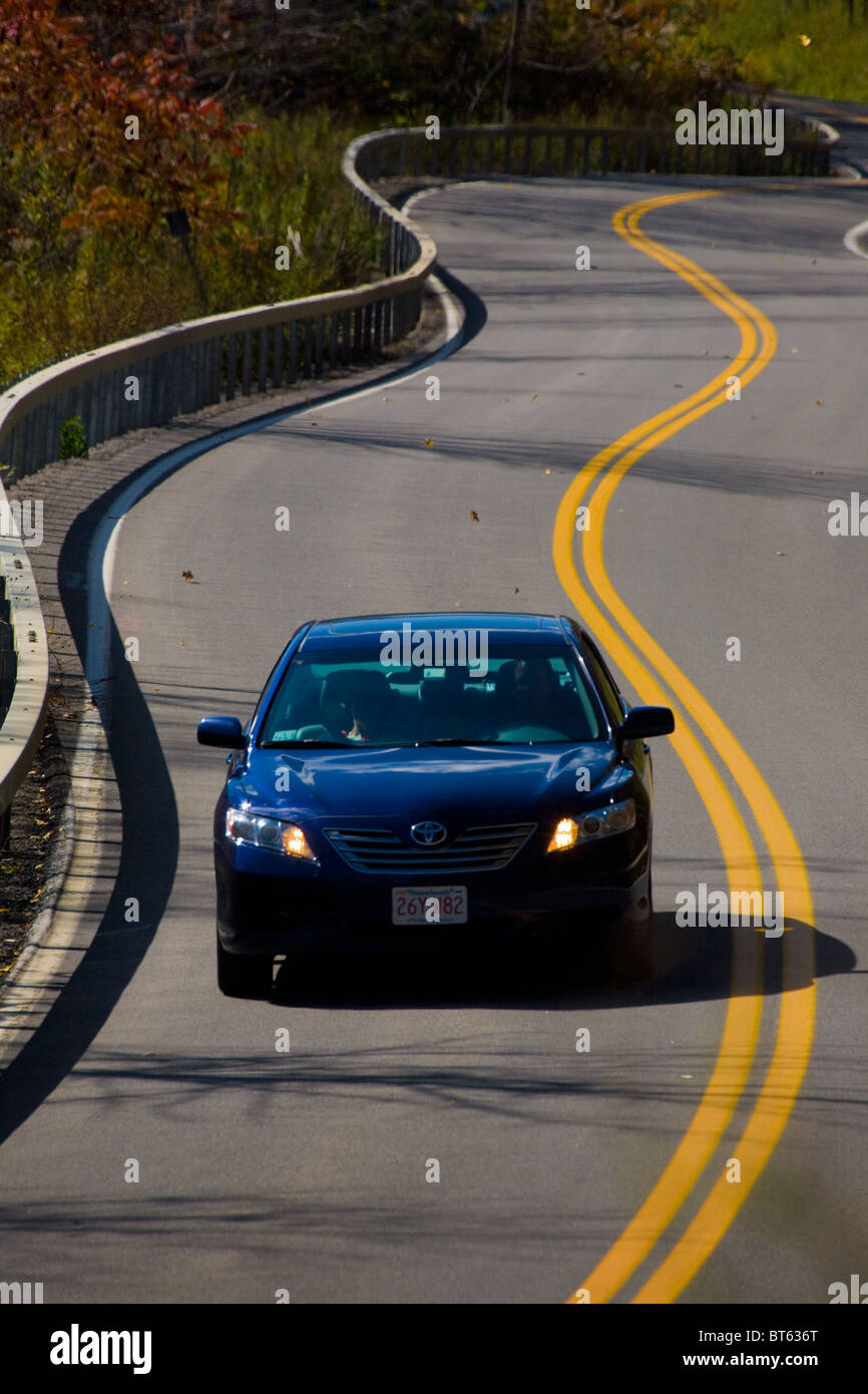 Car on a winding road upstate New York Stock Photo