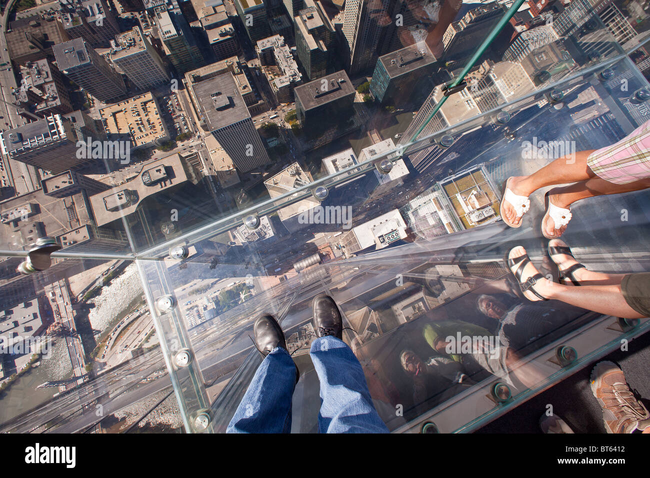 Looking down through the glass balcony Skydeck observation at the Willis Tower Sears Tower in Chicago Stock Photo