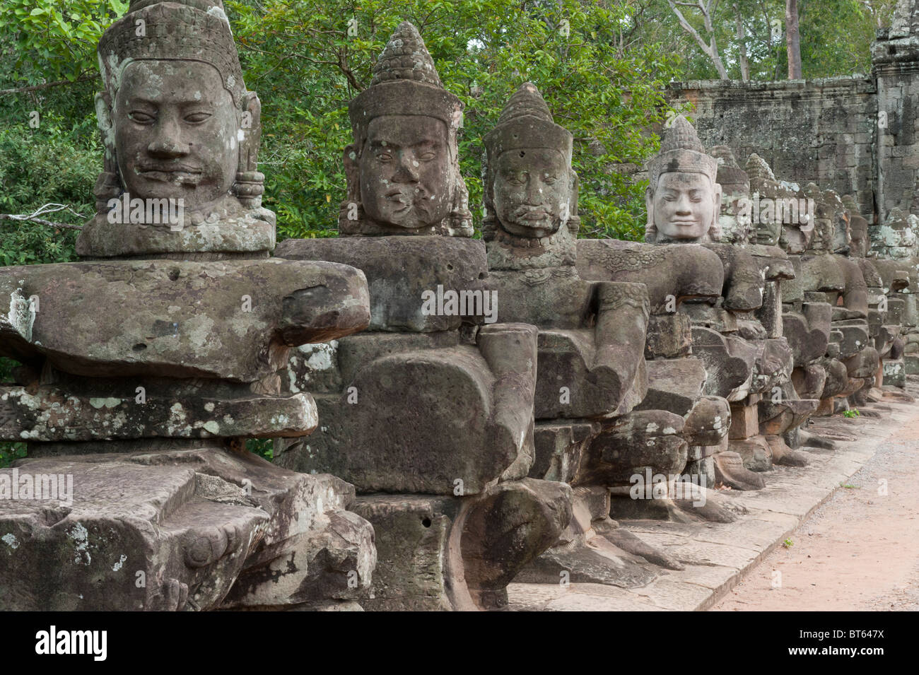 Ancient buddha statues on bridge angkor thom hi-res stock photography ...