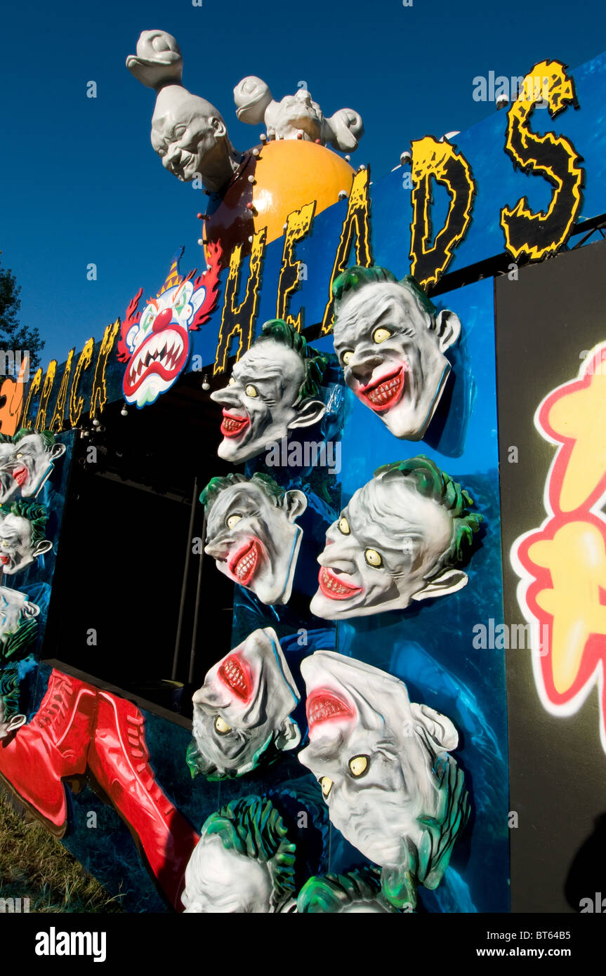 2010 Glastonbury Festival of Contemporary Performing Arts festival head heads joker mask famous red lip green hair comedy charac Stock Photo