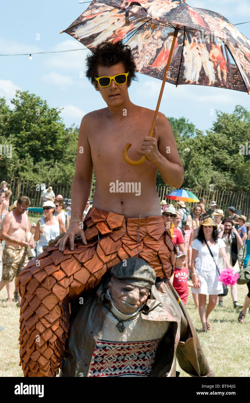 2010 Glastonbury Festival of Contemporary Performing Arts festival bronze merman fish sea umbrella Stock Photo