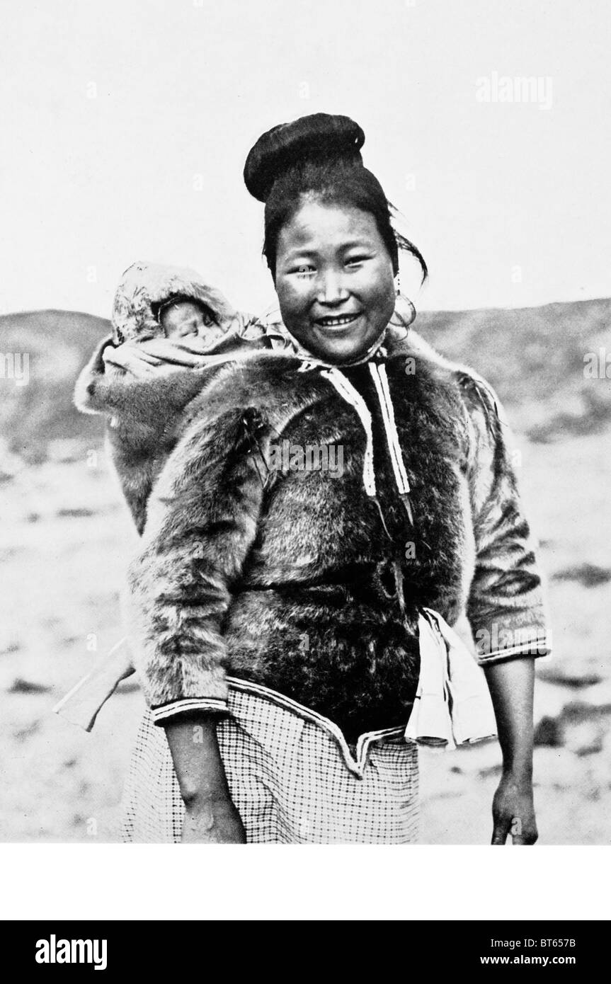 eskimo mother baby sealskin anorak inuit arctic north pole polar female Arctic regions of Canada (Northwest Territories, Nunatsi Stock Photo