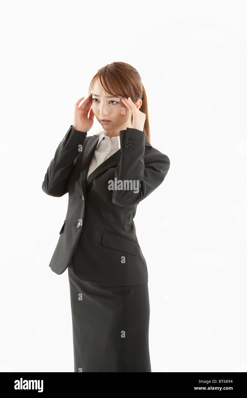 Businesswoman suffering from headache Stock Photo