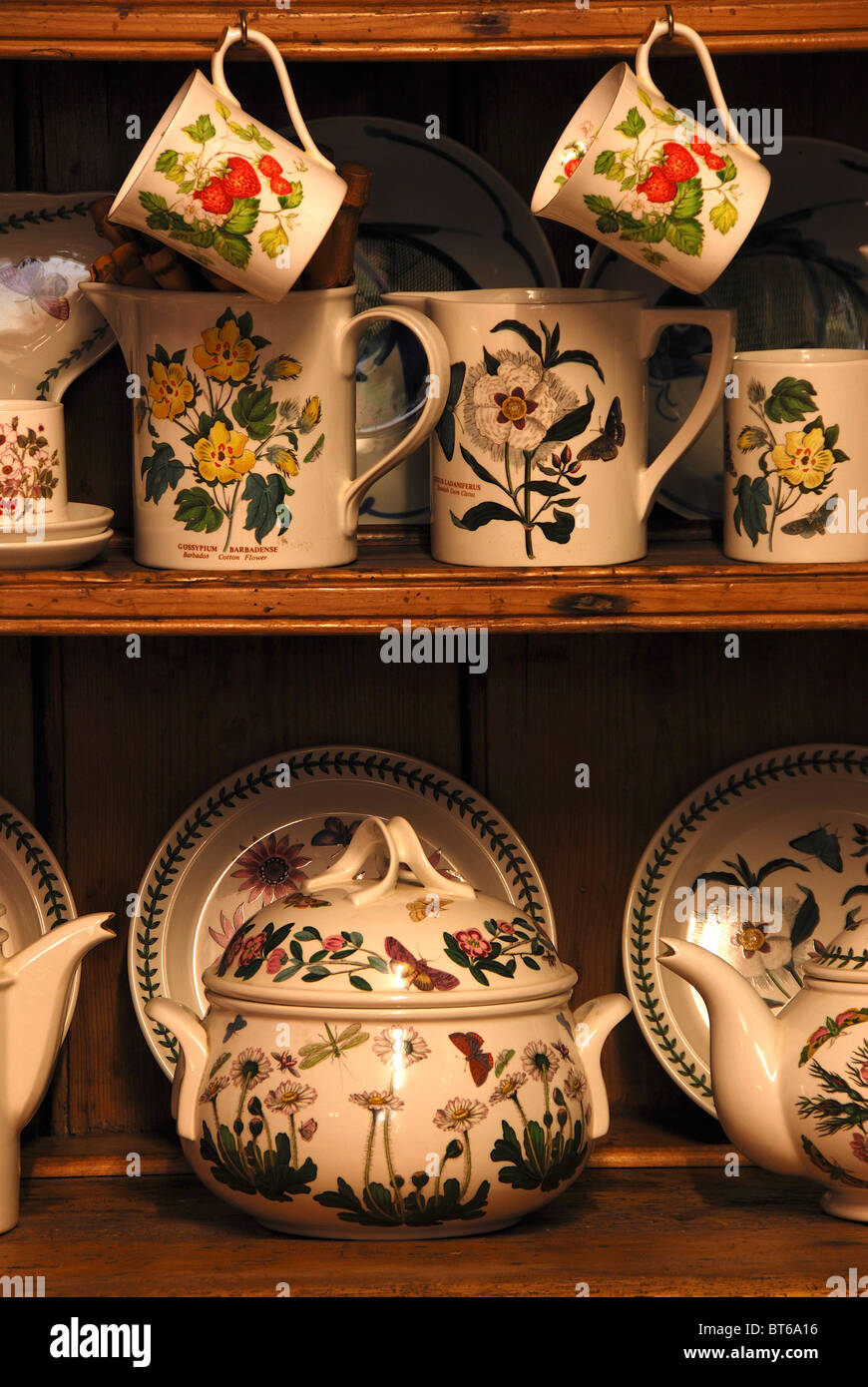 A mixture of crockery on shelves on a pine Welsh dresser. October 2010 Stock Photo