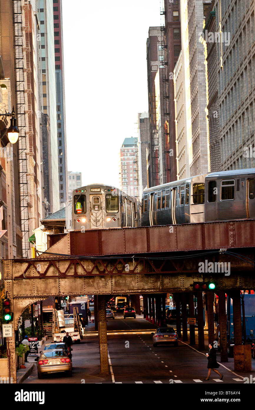 Trains of the Chicago rapid transit system known as the'L' pass over head in the LOOP district in Chicago, IL, USA. Stock Photo