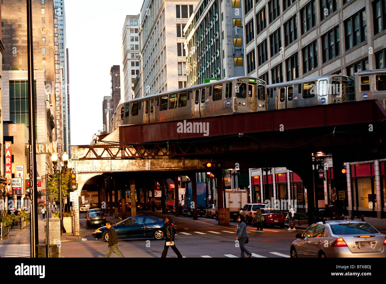 Trains of the Chicago rapid transit system known as the'L' pass over head in the LOOP district in Chicago, IL, USA. Stock Photo