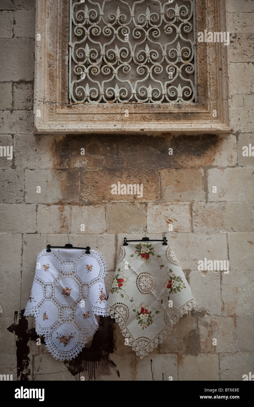 Local embroidered table linen with traditional patterns for sale in the streets of Dubrovnik. Stock Photo