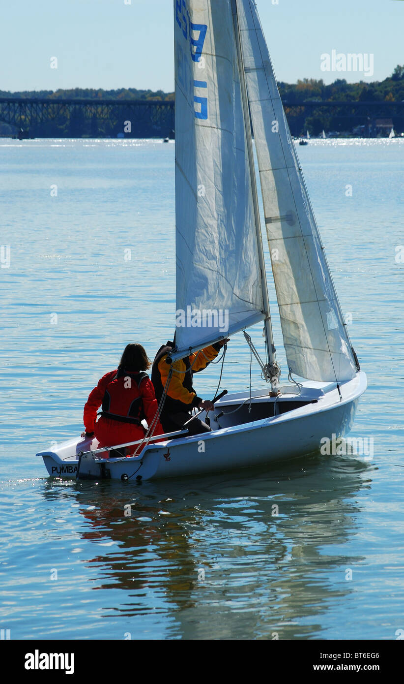 Young couple prepare to sail. Stock Photo