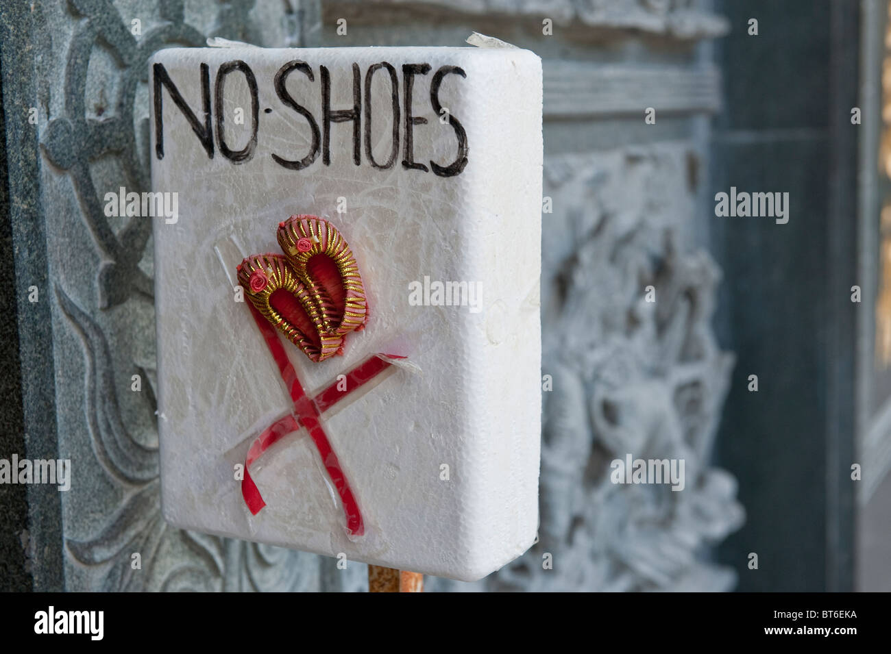 Cute Home-made 'No Shoes' sign in Kek Lok Si Temple in Penang, Malaysia Stock Photo