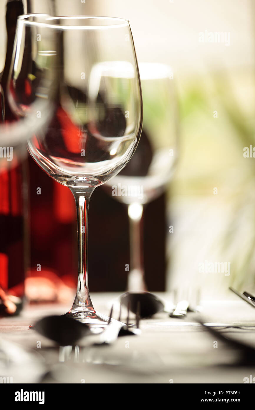 Restaurant wine glasses and place settings Stock Photo