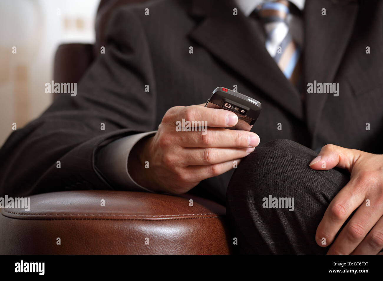 Checking email or text messaging on mobile phone Stock Photo