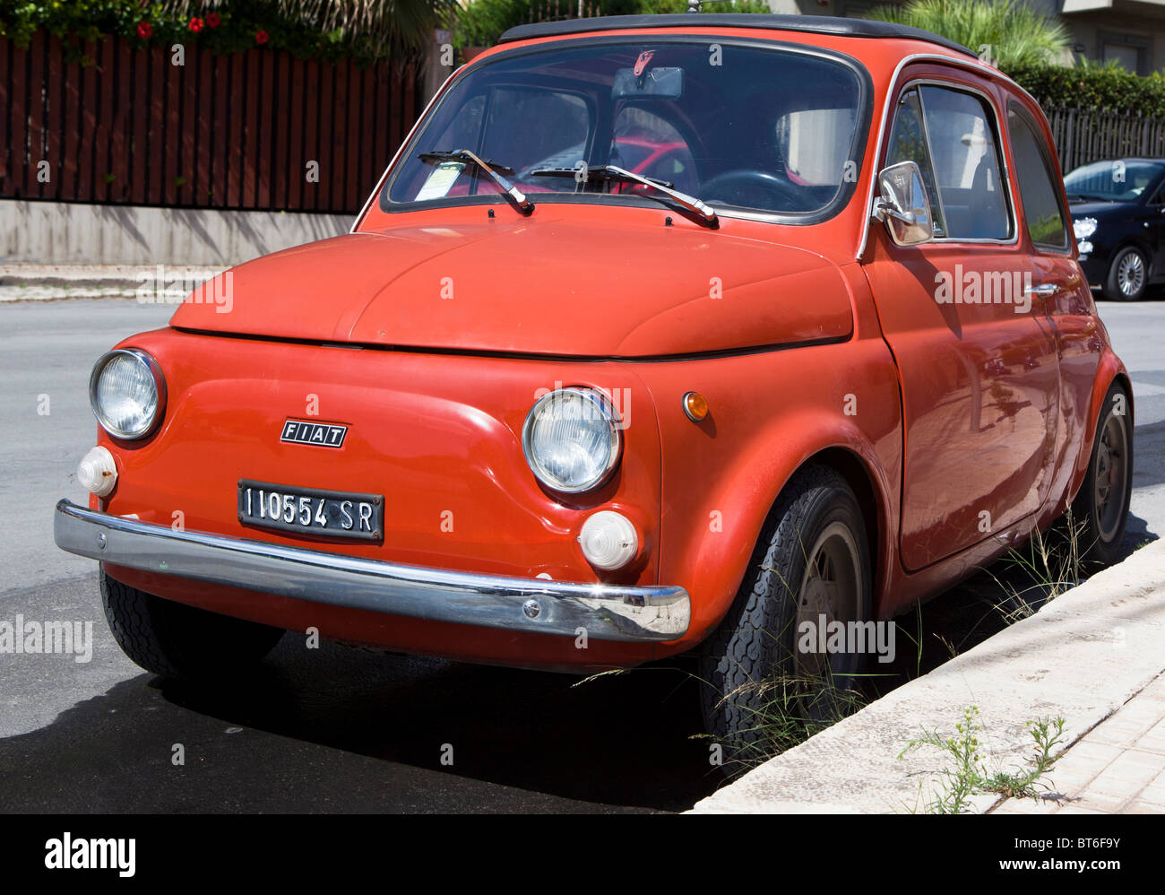 Red Fiat 500 Cinquecento Topolino in Sicily, Italy Stock Photo