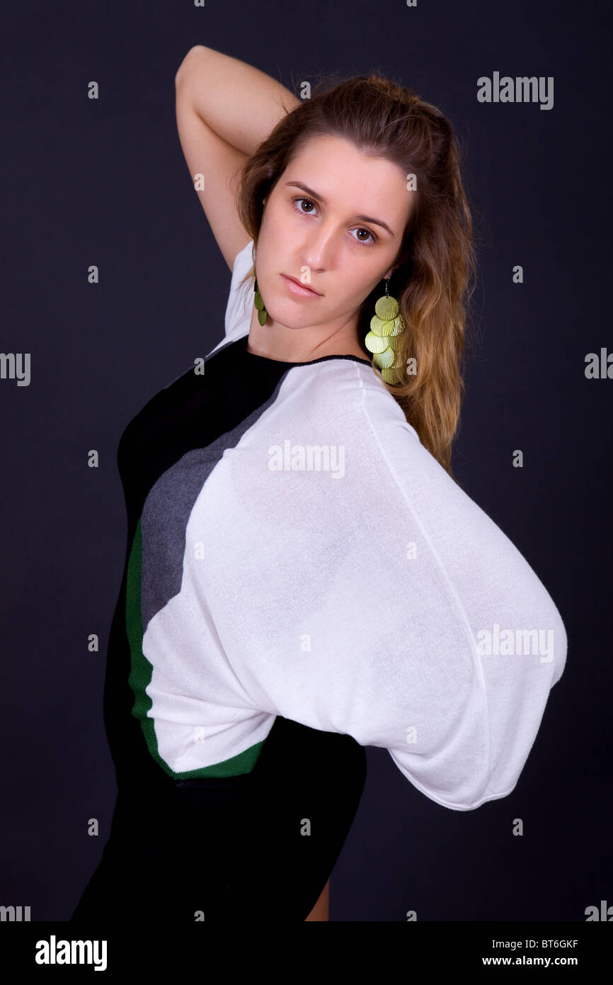 an young beautiful woman portrait on a black background Stock Photo - Alamy