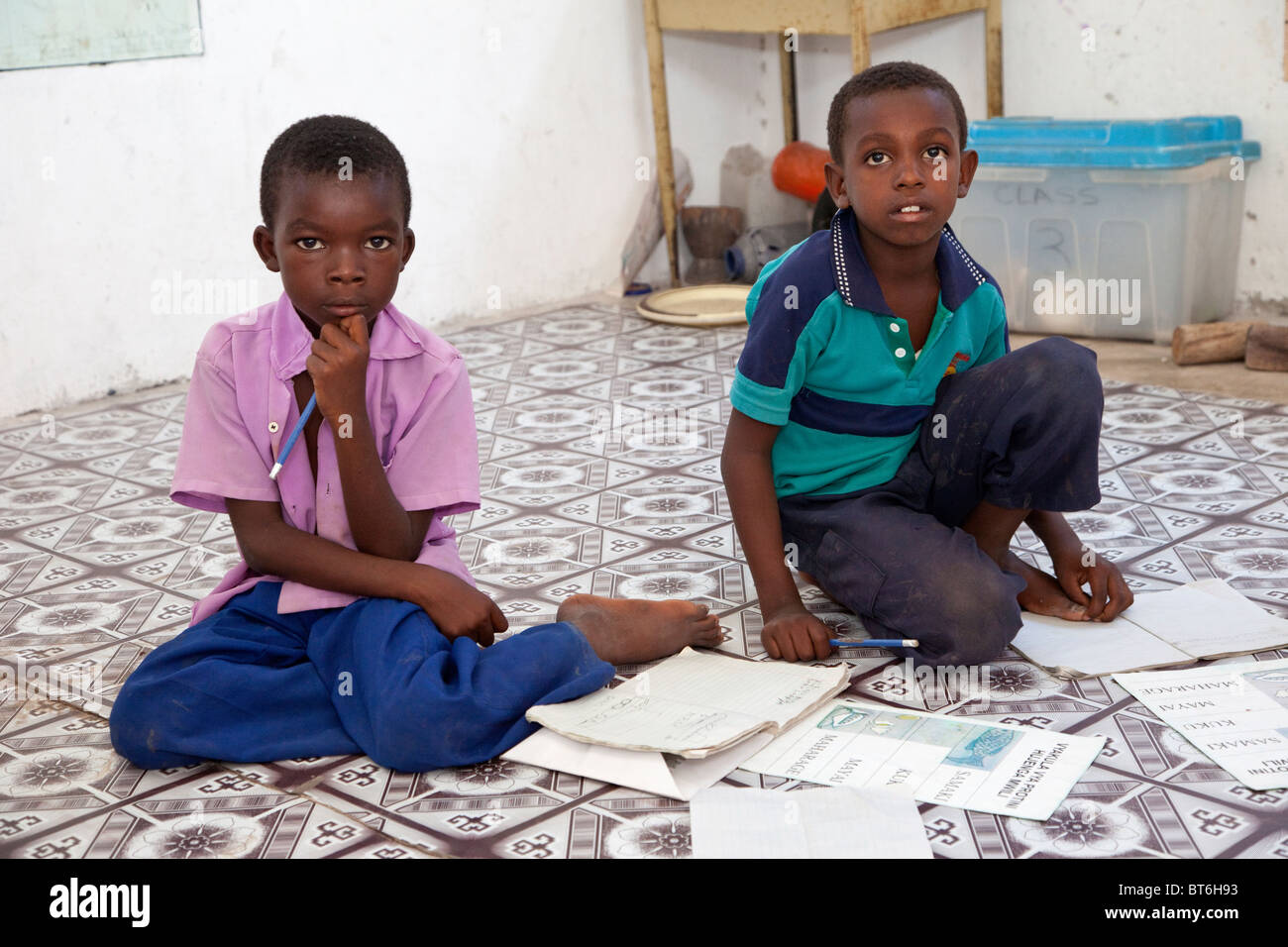 Jambiani, Zanzibar, Tanzania. Primary School Boys and their Workbooks. Stock Photo