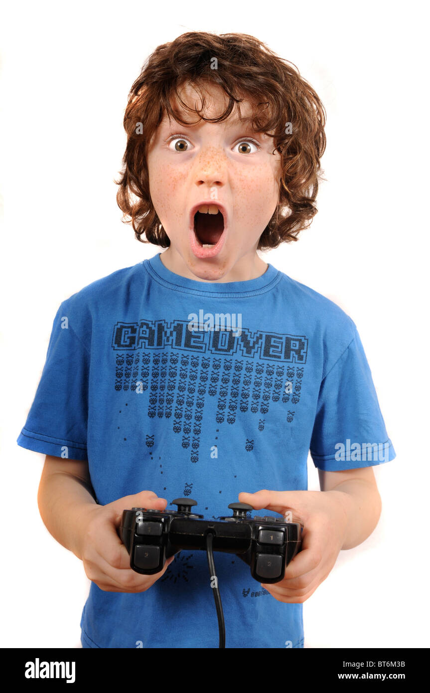 Young boy playing with games controller of console Stock Photo